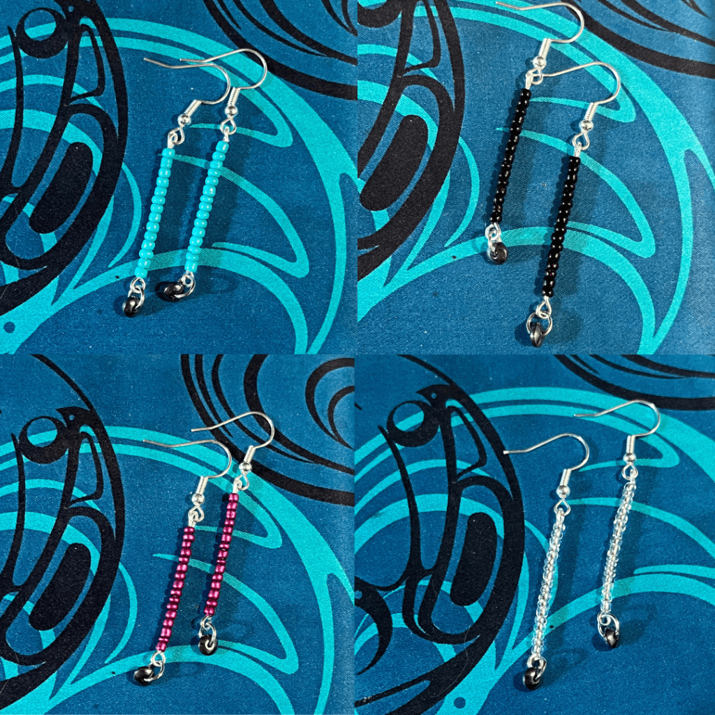 Four pairs of stick earrings, each with a dark grey hematite semi-precious stone at the end of each earring. Each earring is made a single colour of glass size 12.90 seed beads in turquoise, black, silver, or fuscia.
